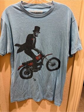 Ames Bros Men's Light Blue Graphic Tee with Abe Lincoln Dirt Bike